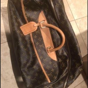 Louis Vuitton barely used duffle roller bag